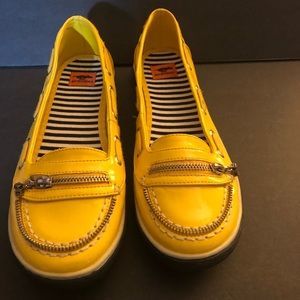 Yellow and black casual shoe by Rocket Dog.
